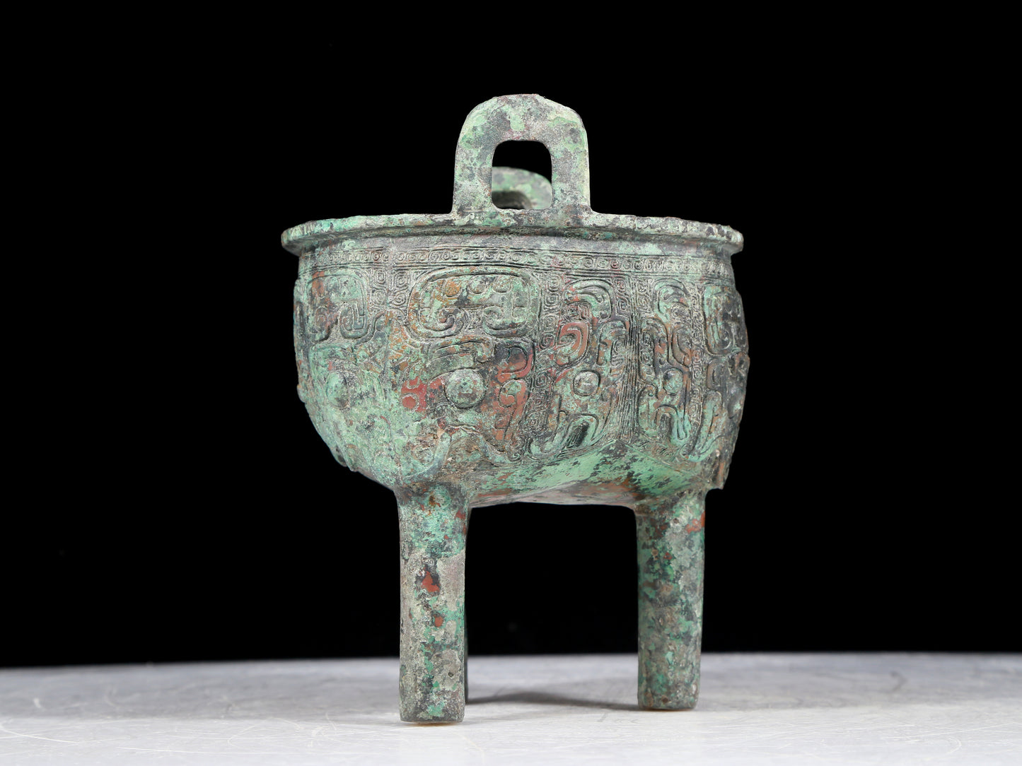 A precious bronze animal-faced two-eared and tripod censer