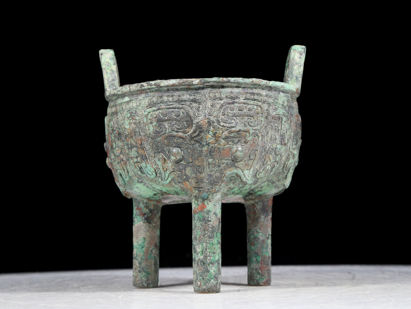 A precious bronze animal-faced two-eared and tripod censer