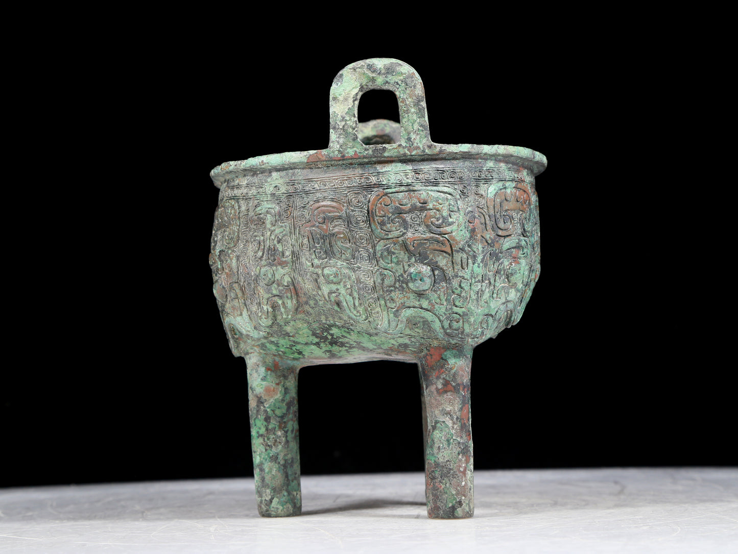 A precious bronze animal-faced two-eared and tripod censer