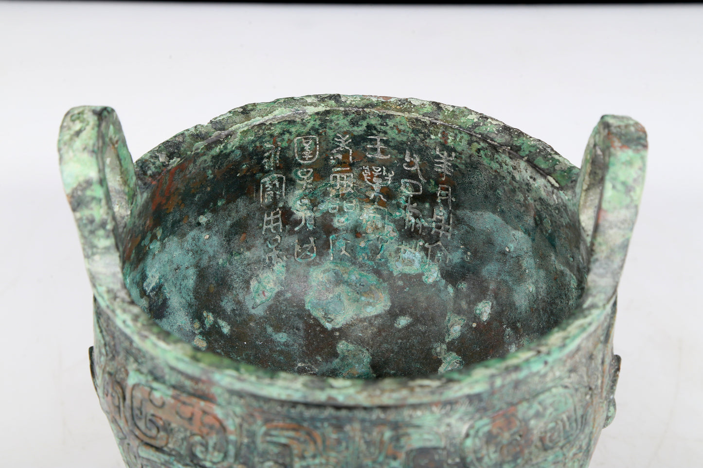 A precious bronze animal-faced two-eared and tripod censer