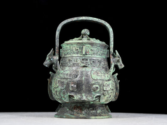 A precious bronze animal-faced pot