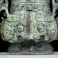 A precious bronze animal-faced pot