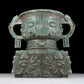 A precious bronze double-eared stove with animal masks