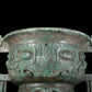 A precious bronze double-eared stove with animal masks