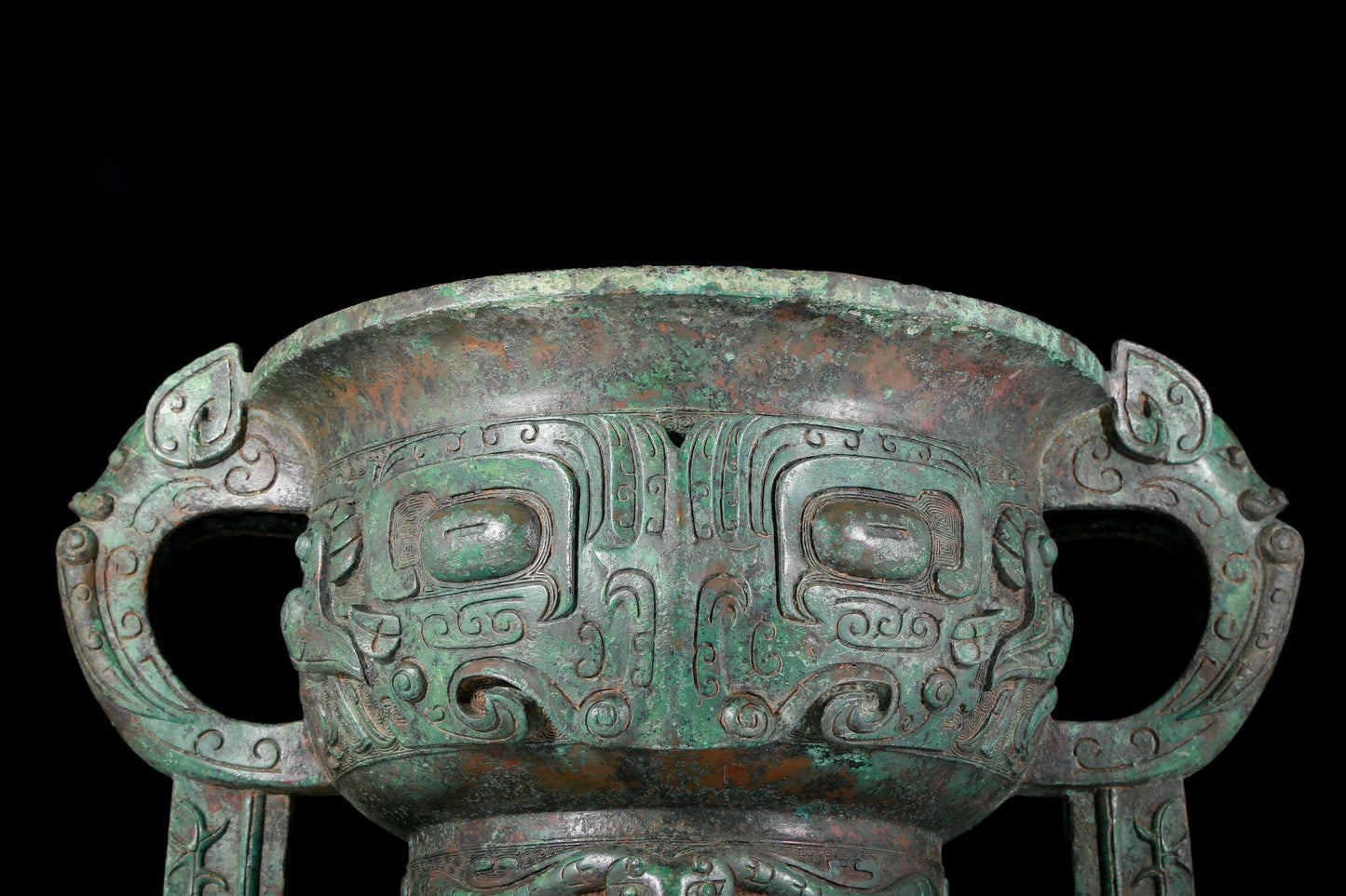 A precious bronze double-eared stove with animal masks