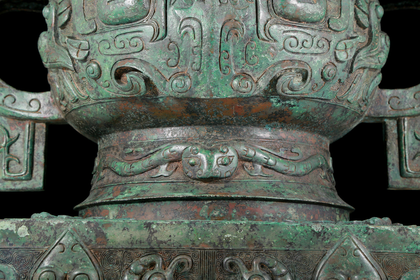 A precious bronze double-eared stove with animal masks