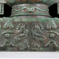 A precious bronze double-eared stove with animal masks