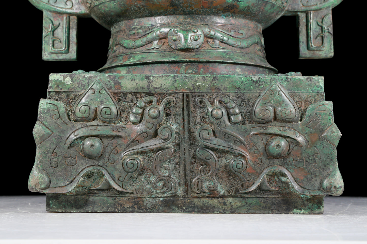 A precious bronze double-eared stove with animal masks