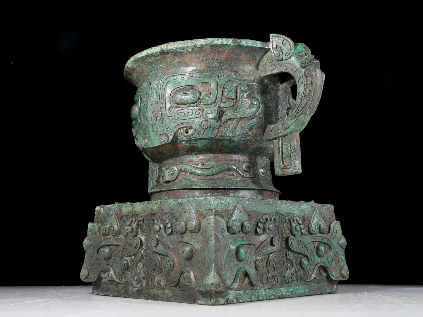 A precious bronze double-eared stove with animal masks