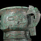 A precious bronze double-eared stove with animal masks