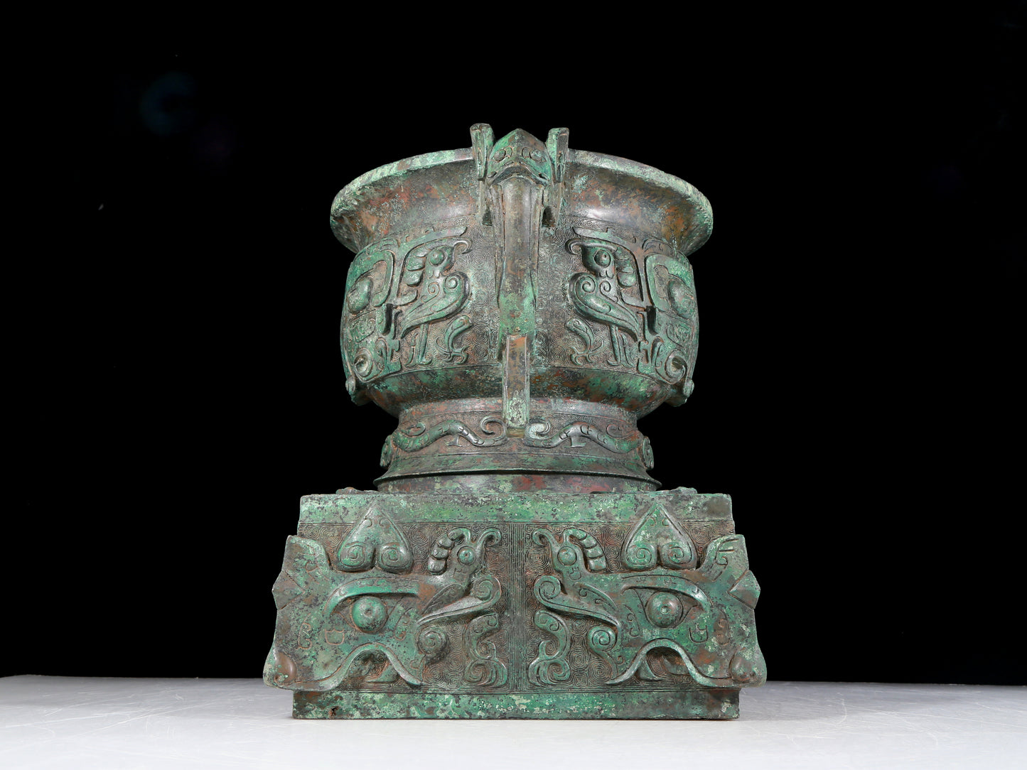 A precious bronze double-eared stove with animal masks