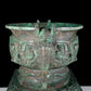 A precious bronze double-eared stove with animal masks