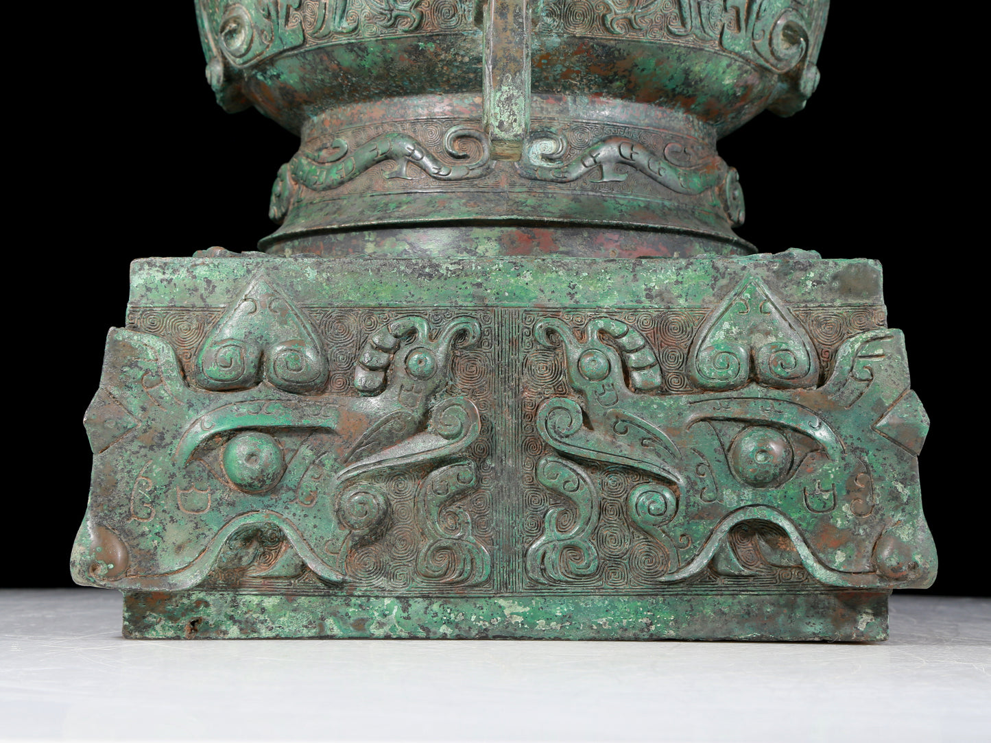 A precious bronze double-eared stove with animal masks