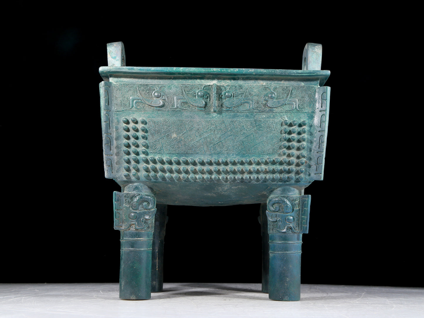 A precious bronze tripod with two ears and four legs with auspicious animal patterns