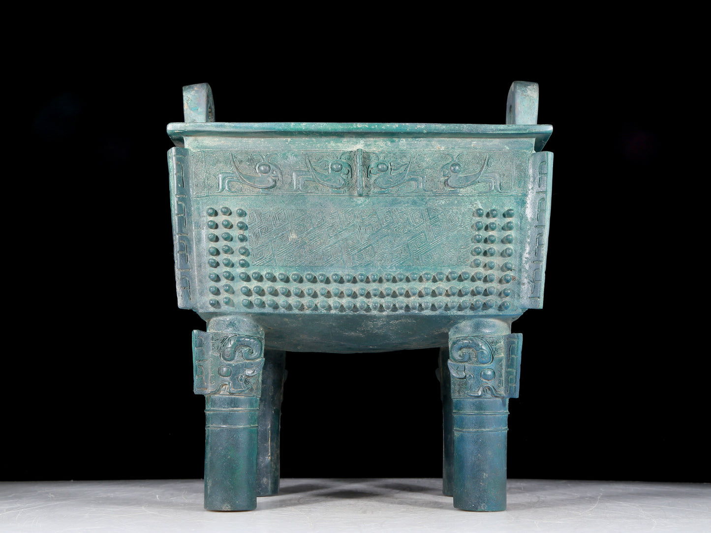 A precious bronze tripod with two ears and four legs with auspicious animal patterns