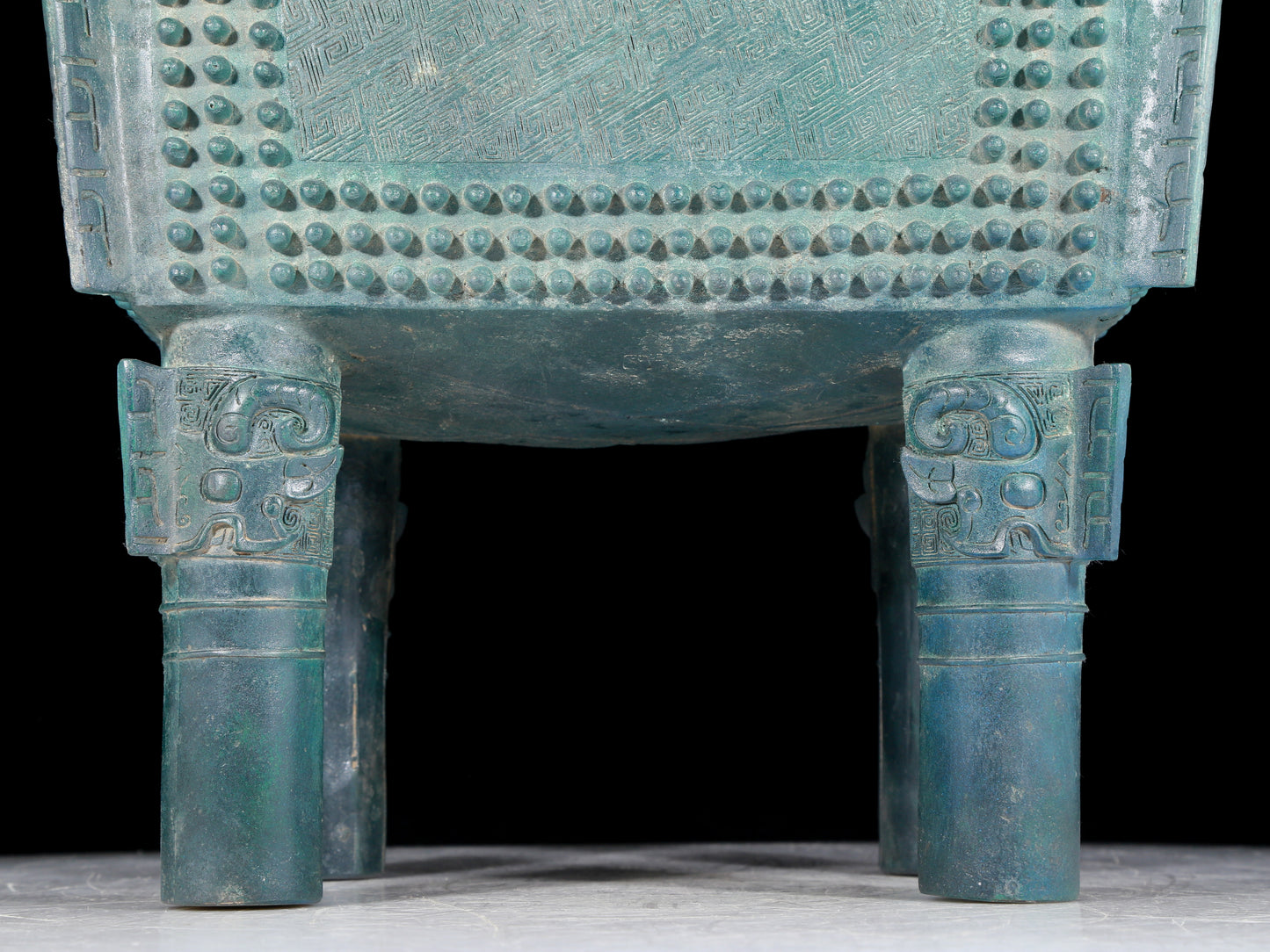 A precious bronze tripod with two ears and four legs with auspicious animal patterns