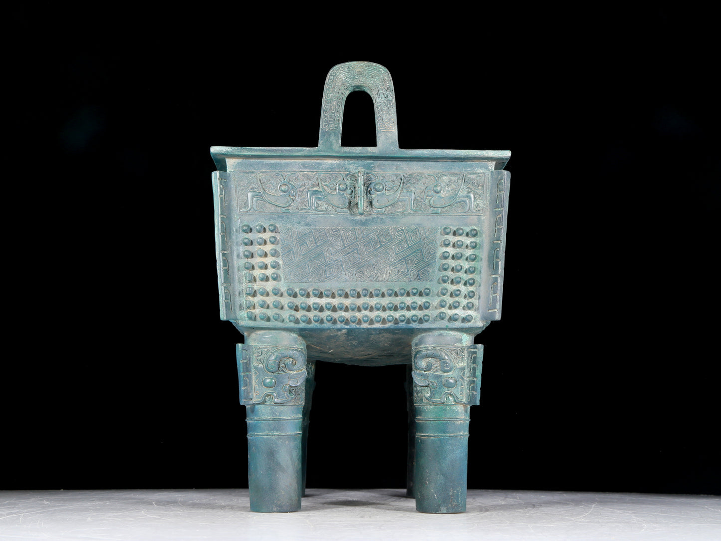 A precious bronze tripod with two ears and four legs with auspicious animal patterns