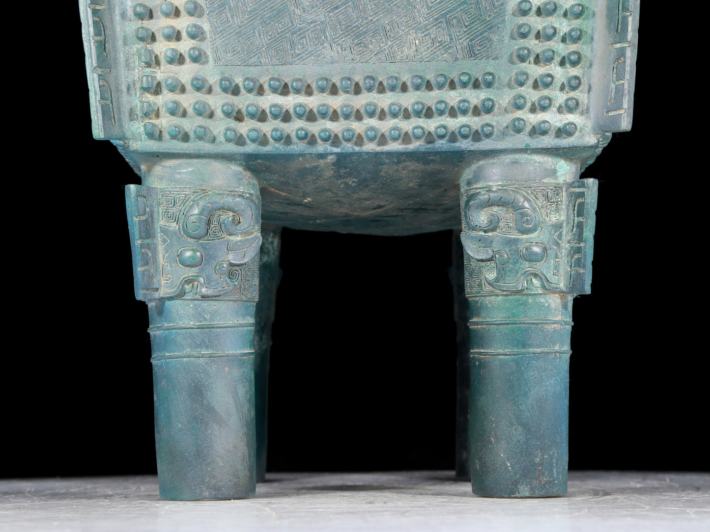 A precious bronze tripod with two ears and four legs with auspicious animal patterns