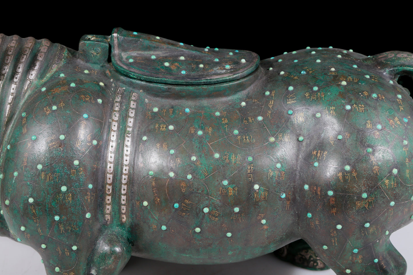 A precious bronze rhinoceros jar inlaid with gold and silver