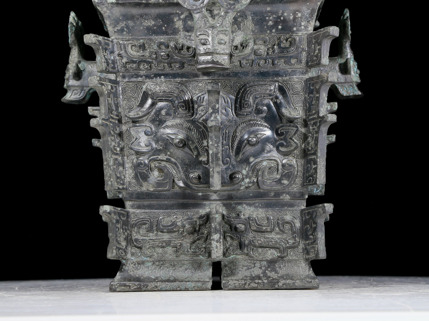 A precious bronze animal mask jar with lid