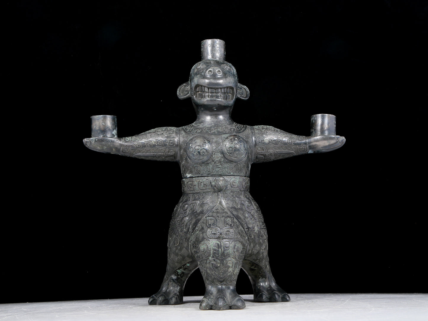 A precious bronze figure candlestick