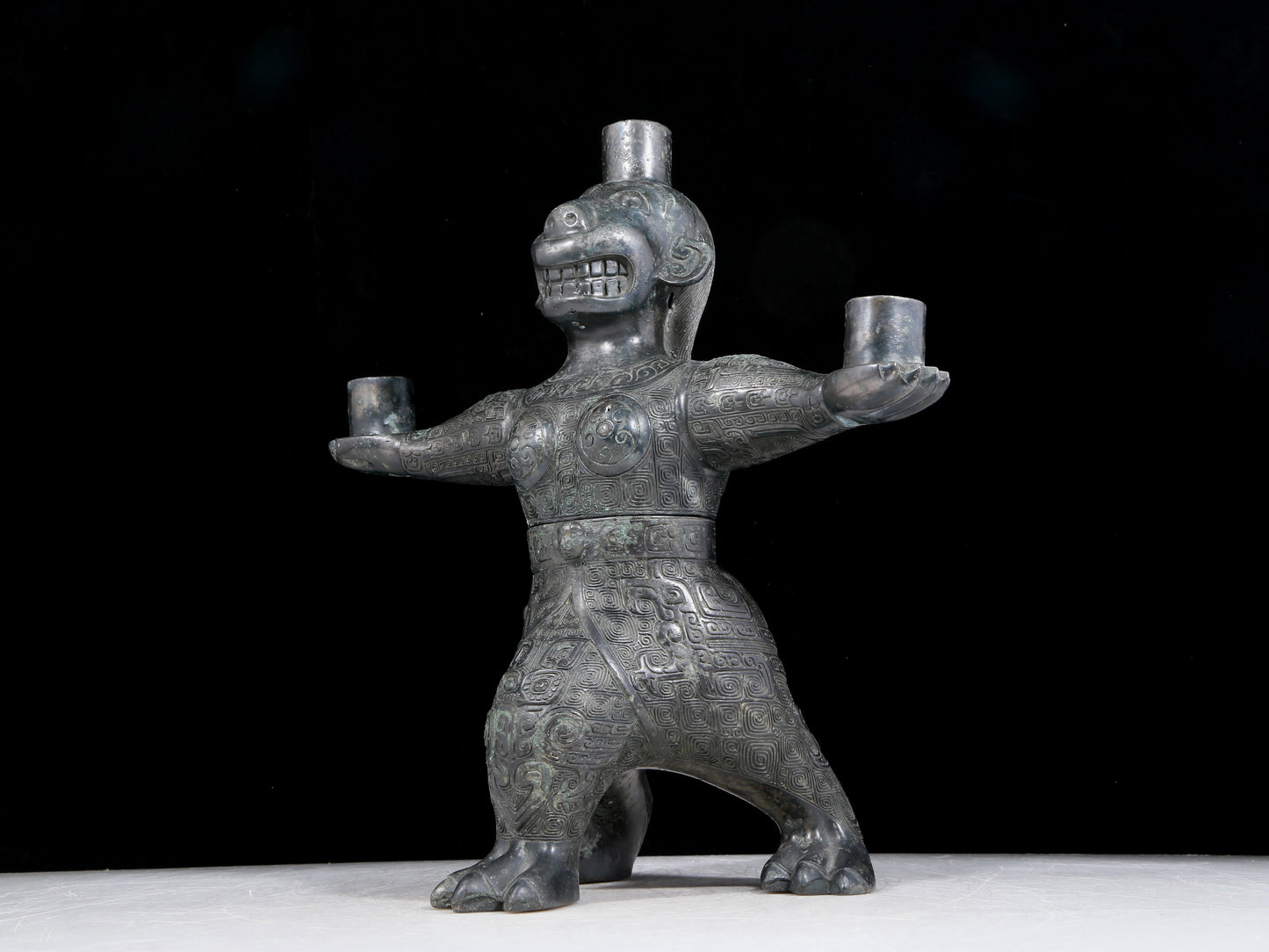 A precious bronze figure candlestick