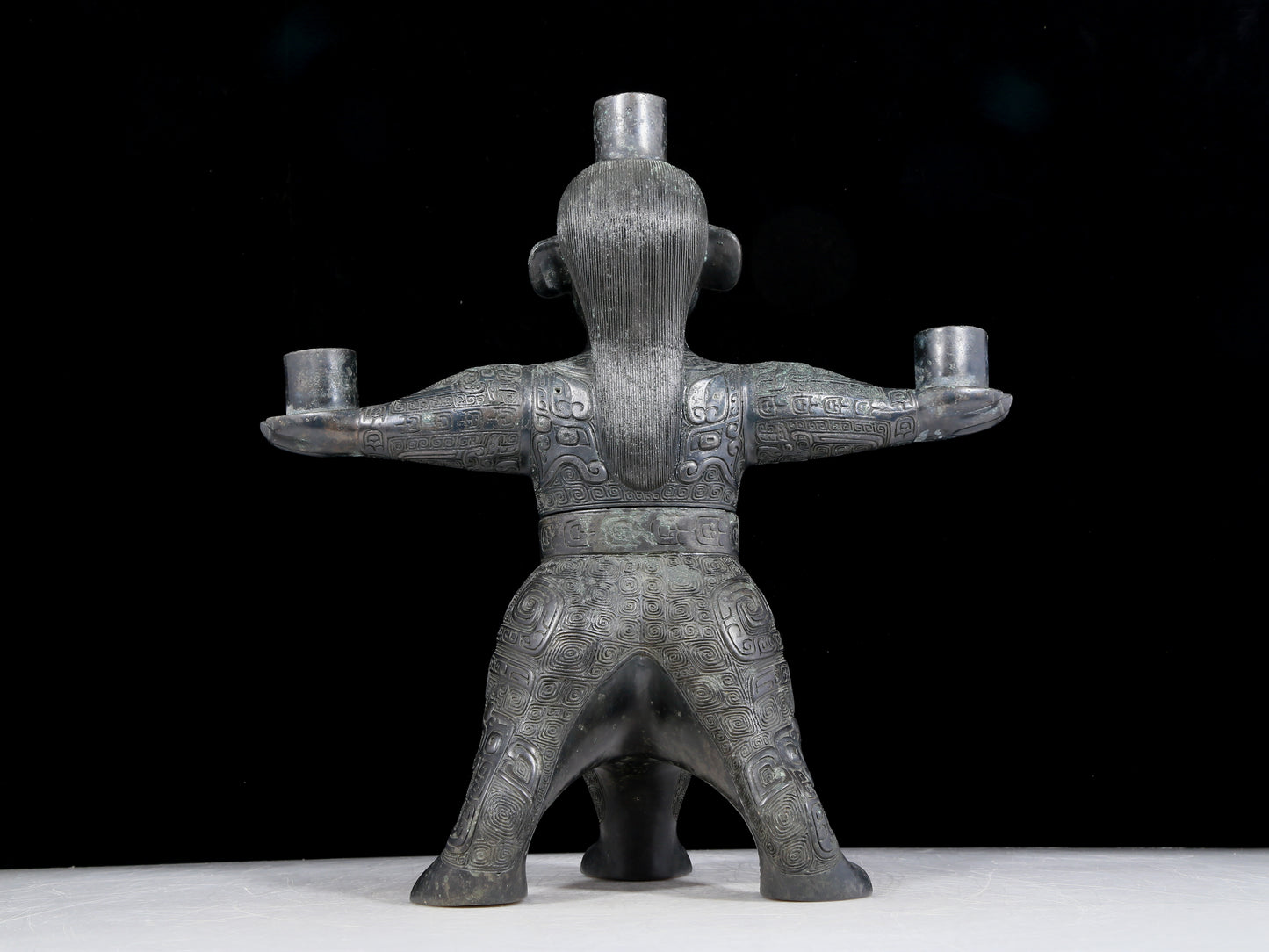 A precious bronze figure candlestick