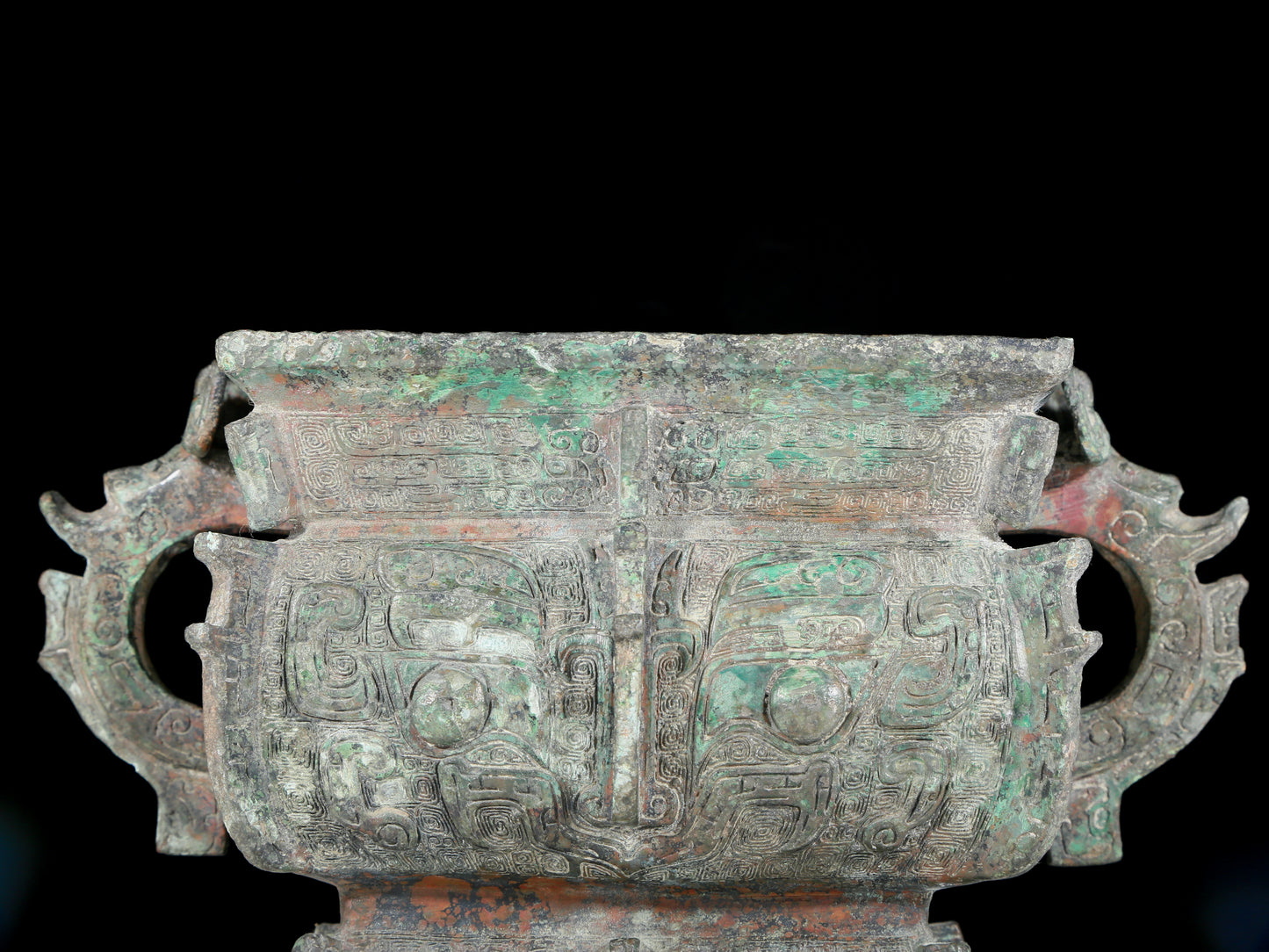 A precious bronze double-eared stove with animal masks