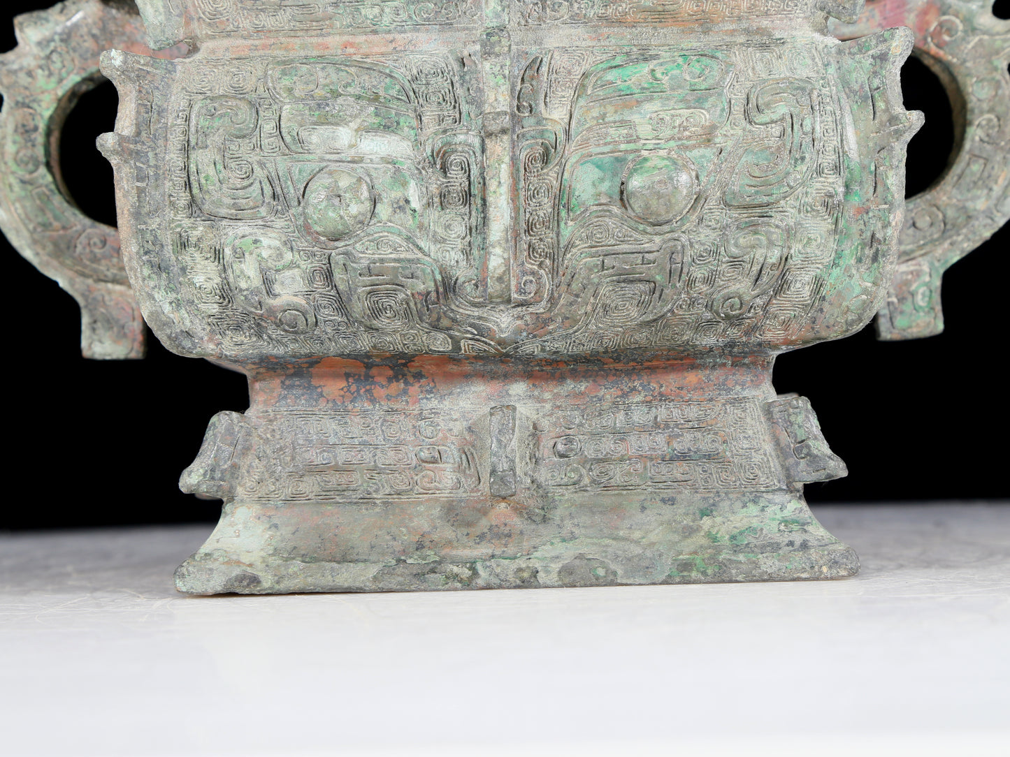 A precious bronze double-eared stove with animal masks