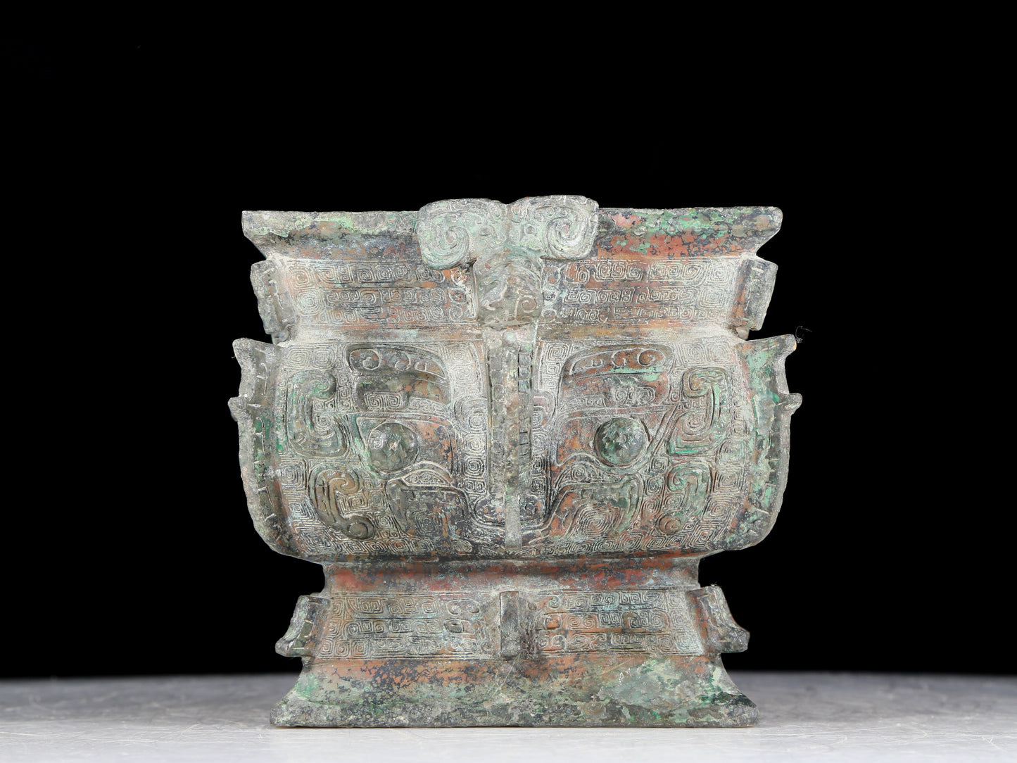 A precious bronze double-eared stove with animal masks