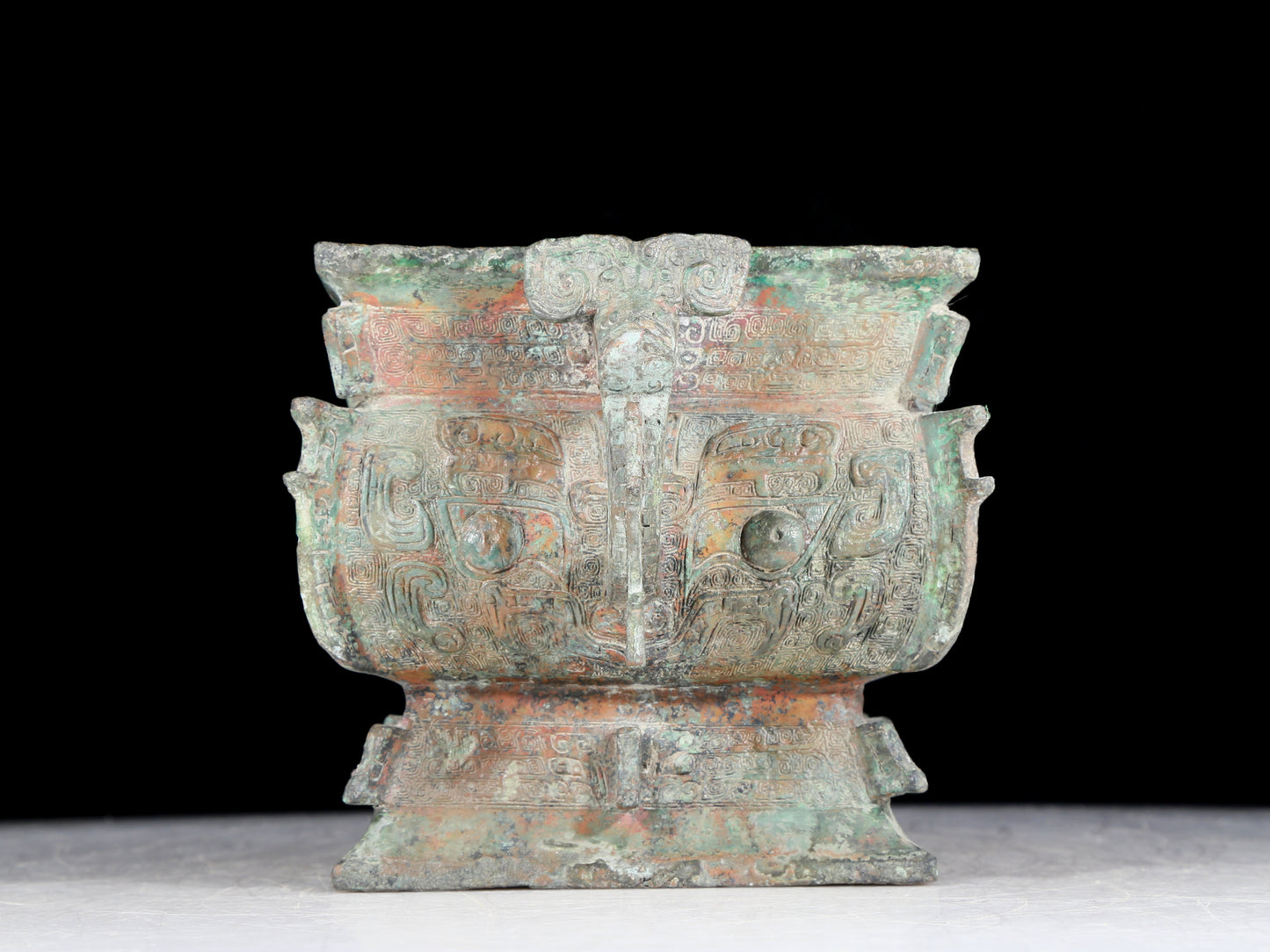 A precious bronze double-eared stove with animal masks