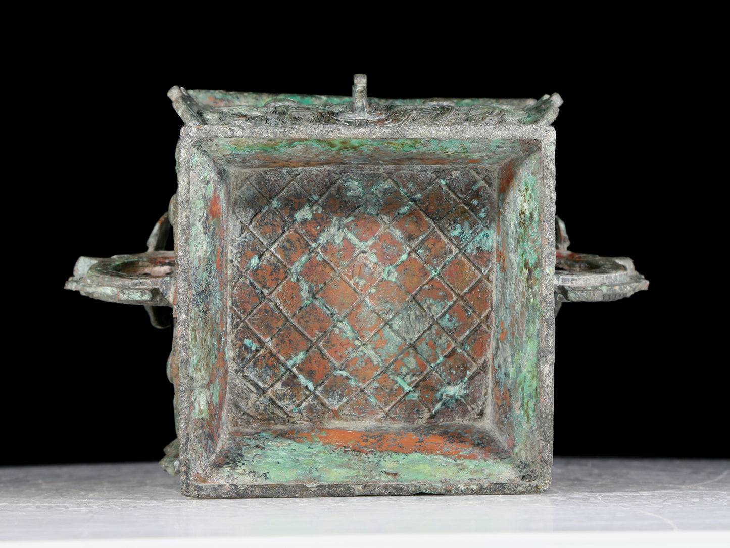 A precious bronze double-eared stove with animal masks