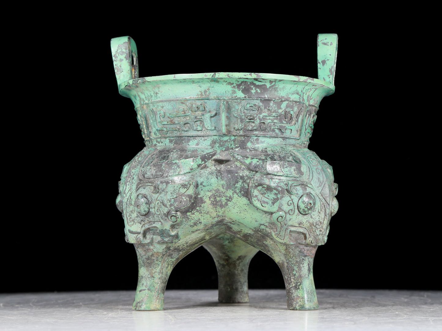 A precious bronze animal-faced two-eared and tripod censer