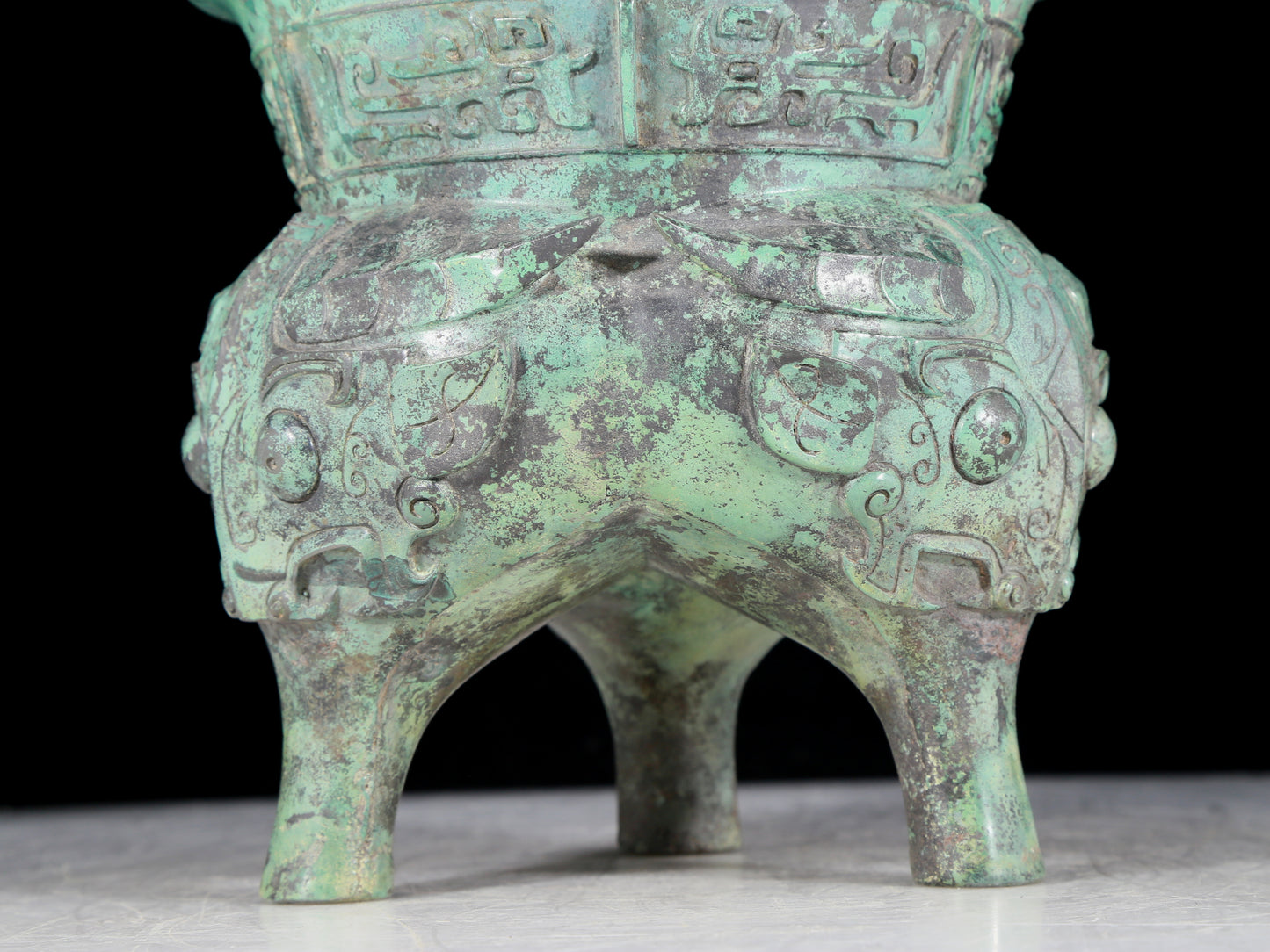 A precious bronze animal-faced two-eared and tripod censer