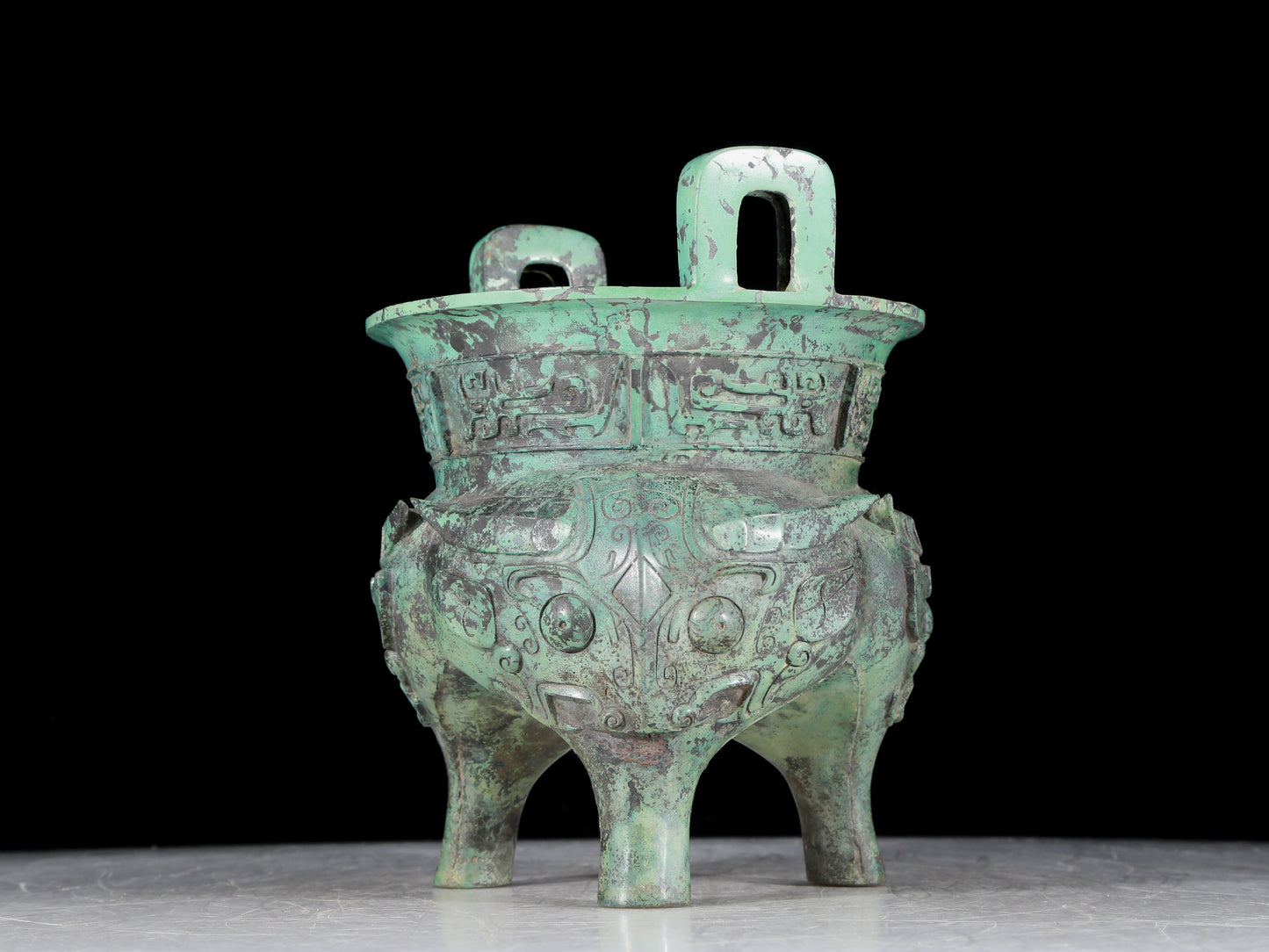 A precious bronze animal-faced two-eared and tripod censer