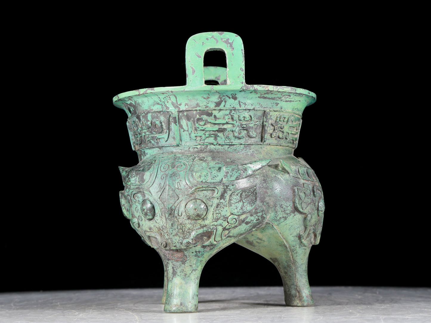 A precious bronze animal-faced two-eared and tripod censer