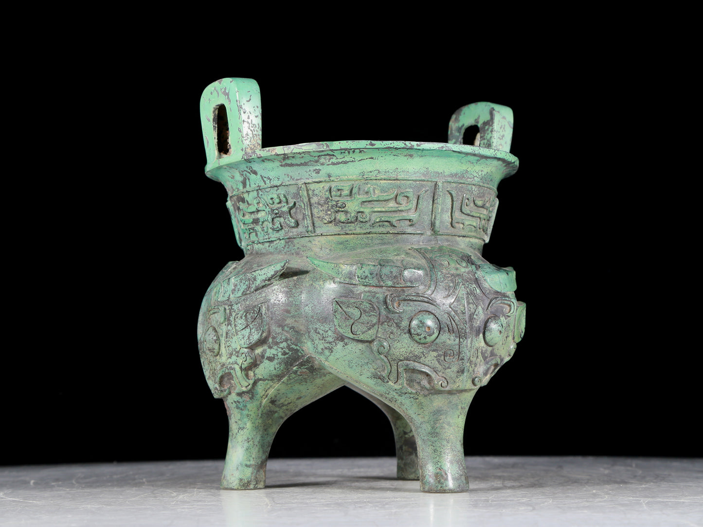 A precious bronze animal-faced two-eared and tripod censer