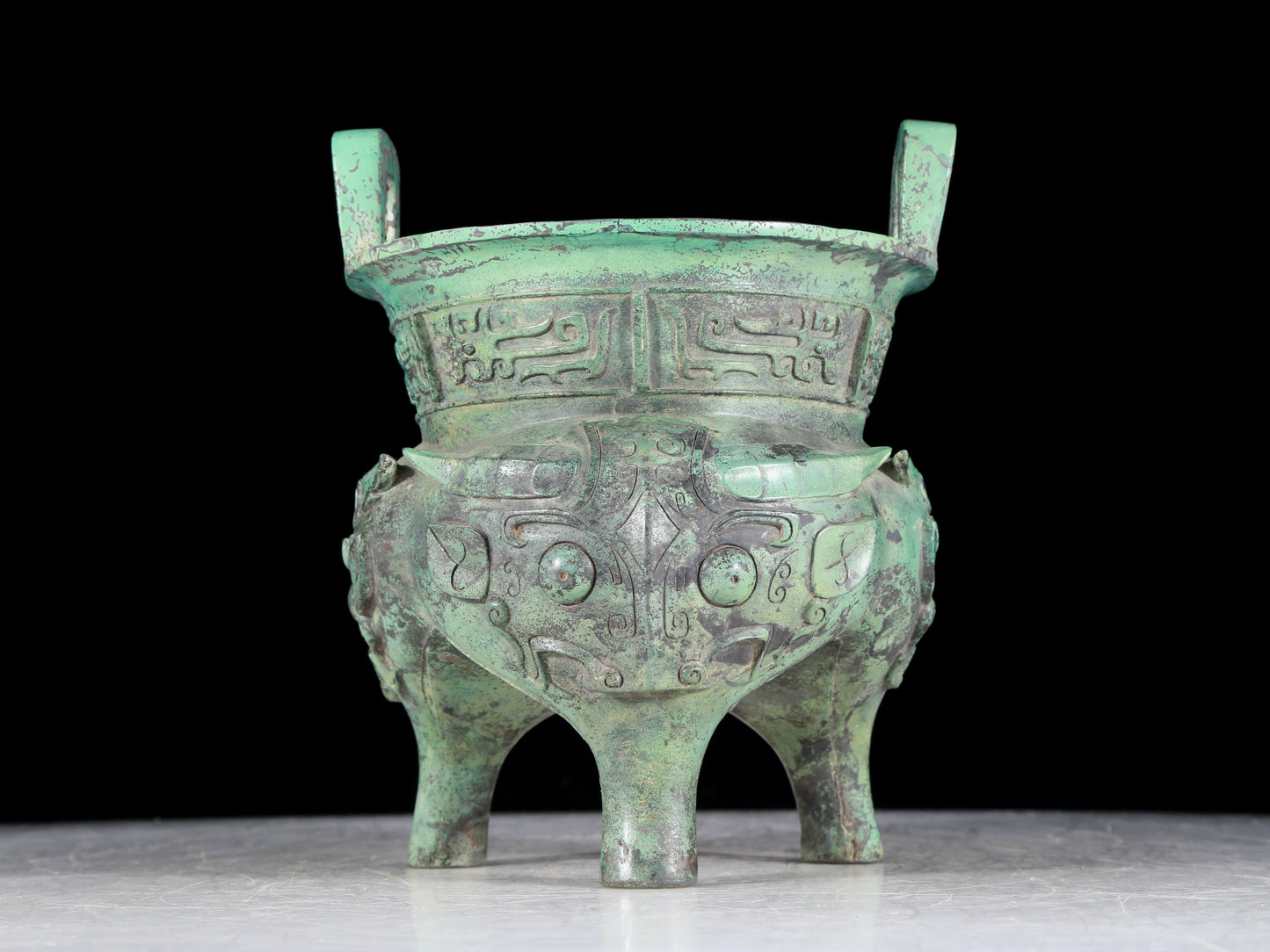 A precious bronze animal-faced two-eared and tripod censer