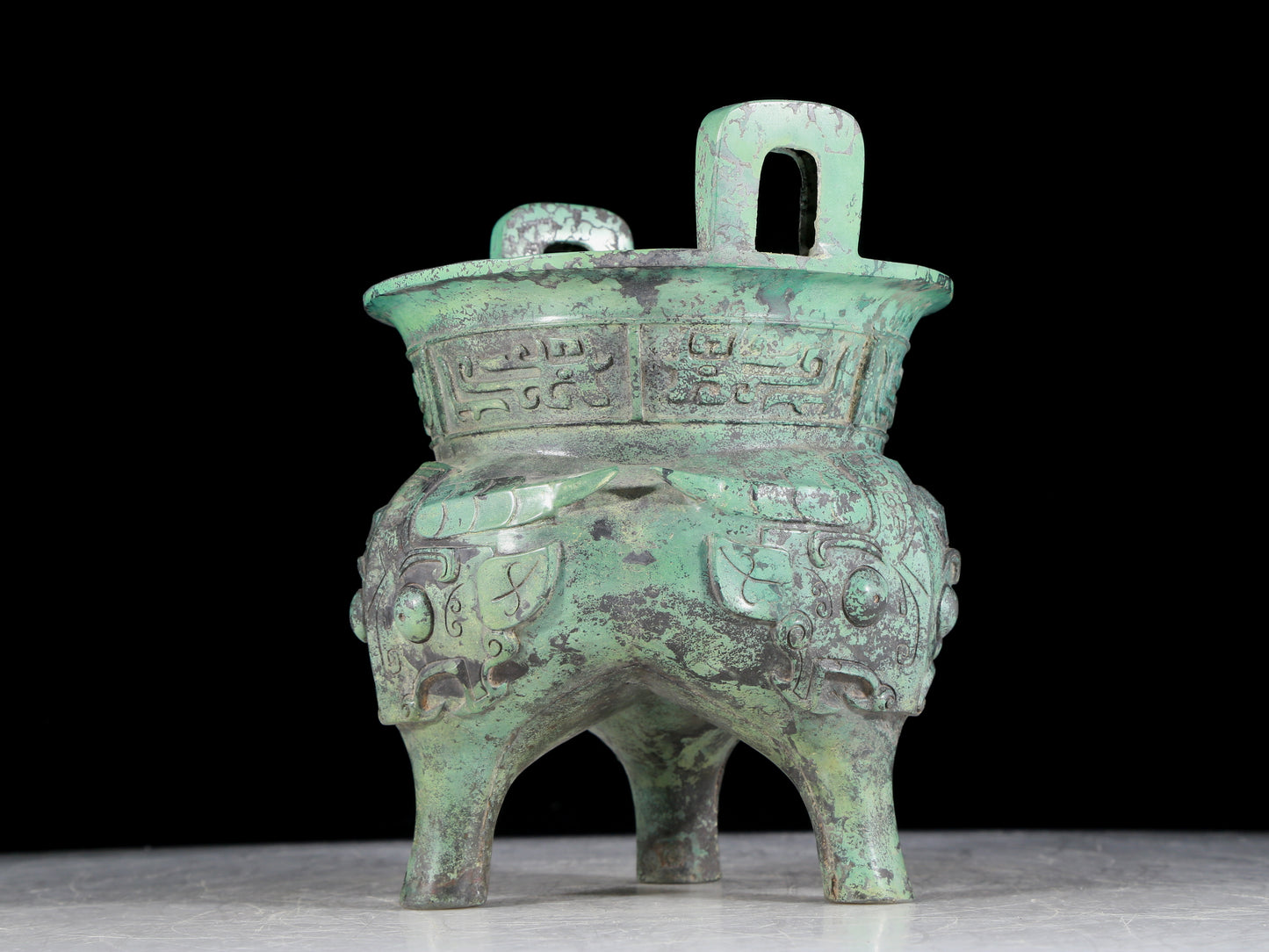 A precious bronze animal-faced two-eared and tripod censer