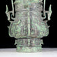 A precious bronze animal-faced pot