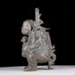 A precious bronze figure carrying a kettle