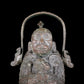 A precious bronze figure carrying a kettle