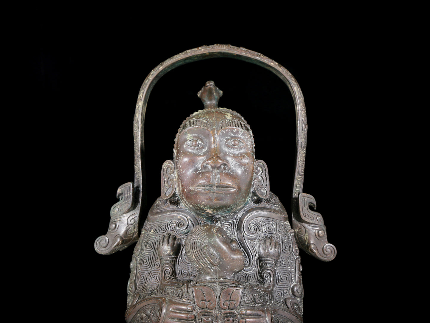 A precious bronze figure carrying a kettle