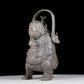 A precious bronze figure carrying a kettle