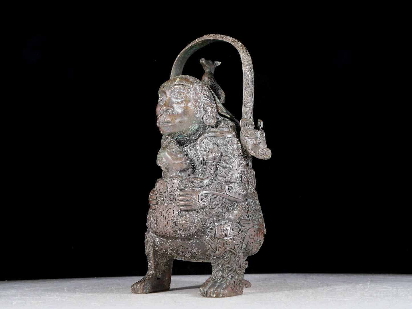 A precious bronze figure carrying a kettle