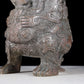 A precious bronze figure carrying a kettle