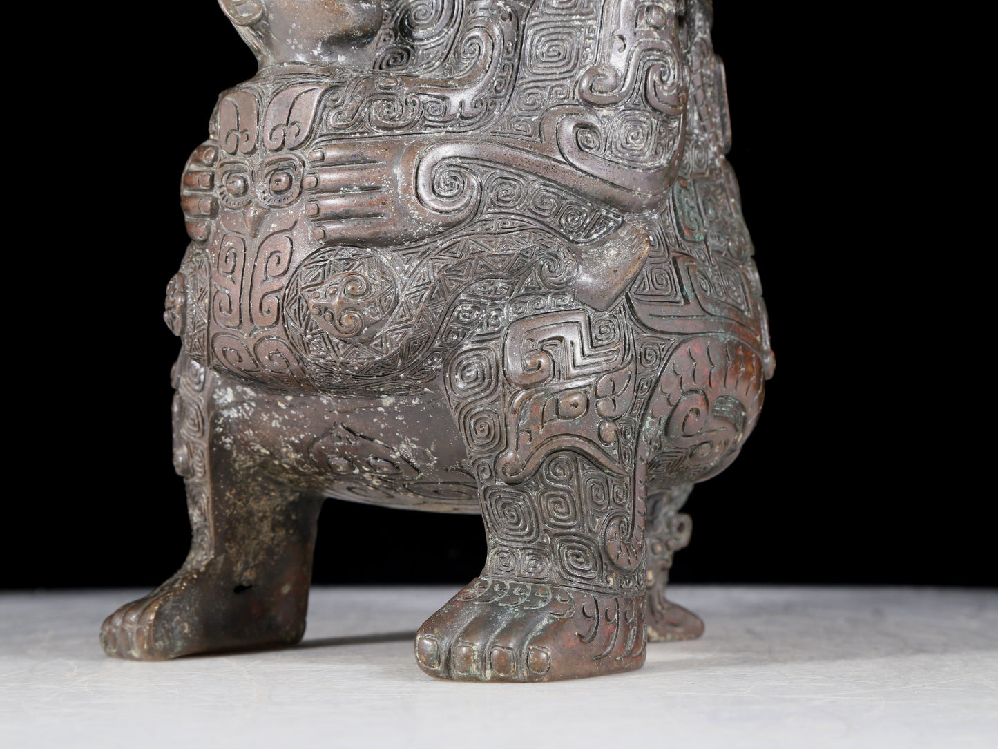 A precious bronze figure carrying a kettle