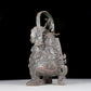 A precious bronze figure carrying a kettle