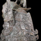 A precious bronze figure carrying a kettle