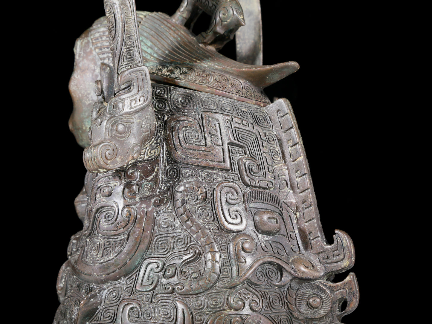 A precious bronze figure carrying a kettle